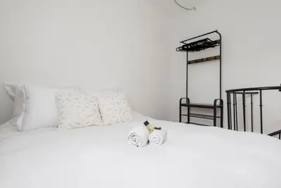 Un ou plusieurs lits dans un hébergement de l'établissement GuestReady - Duplex spacieux et lumineux
