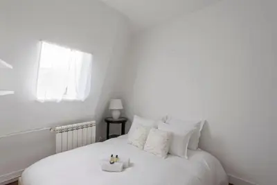 Un ou plusieurs lits dans un hébergement de l'établissement GuestReady - Duplex spacieux et lumineux
