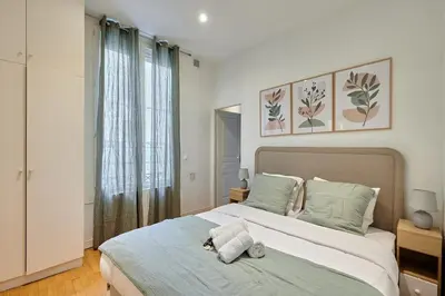 Un ou plusieurs lits dans un hébergement de l'établissement Apartment center of Paris by Studio prestige