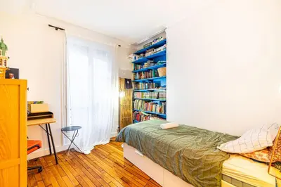 Un ou plusieurs lits dans un hébergement de l'établissement GuestReady - Loveliness near Pont Mirabeau