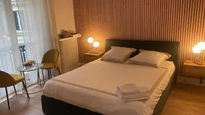 Un ou plusieurs lits dans un hébergement de l'établissement Studio opéra paris
