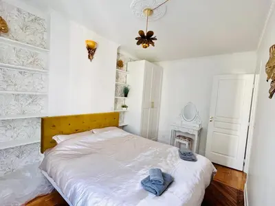 Un ou plusieurs lits dans un hébergement de l'établissement Paris rare pearl 5e Notre Dame Saint Michel