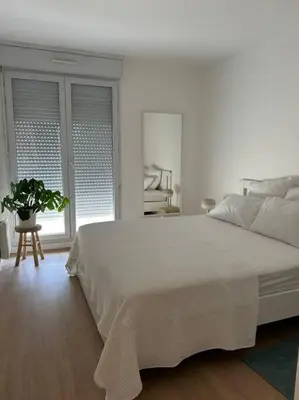 Un ou plusieurs lits dans un hébergement de l'établissement Appart Cosy de 52m2