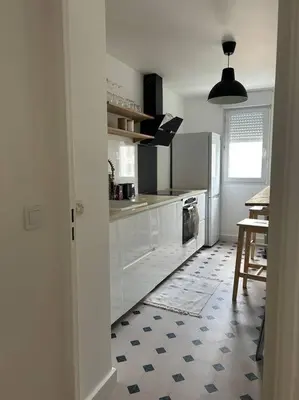 Cuisine ou kitchenette dans l'établissement Appart Cosy de 52m2