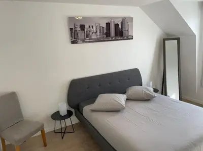 Un ou plusieurs lits dans un hébergement de l'établissement Appartement 3p Ivry