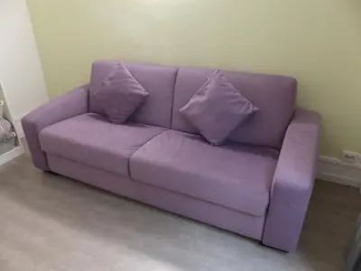 Coin salon dans l'établissement Charmant logement près Parc Buttes Chaumont