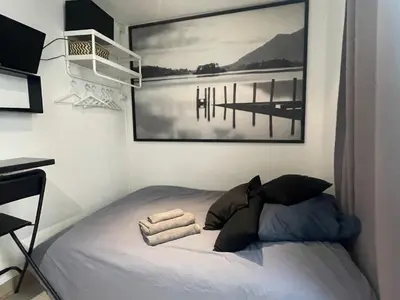 Un ou plusieurs lits dans un hébergement de l'établissement Calm And Cozy