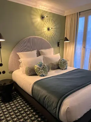 Un ou plusieurs lits dans un hébergement de l'établissement LE CLARK HOTEL