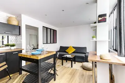 Coin salon dans l'établissement 318 Suite Pivert - Superb apartment in Paris