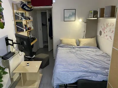 Un ou plusieurs lits dans un hébergement de l'établissement Studio confortable Paris