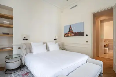 Un ou plusieurs lits dans un hébergement de l'établissement Appartement Avenue Montaigne - Paris Champs Elysées