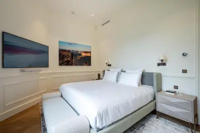 Un ou plusieurs lits dans un hébergement de l'établissement Appartement Avenue Montaigne - Paris Champs Elysées
