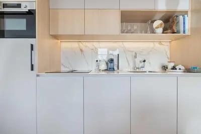 Cuisine ou kitchenette dans l'établissement Elegant apartment - 2BR-4P - Vivienne