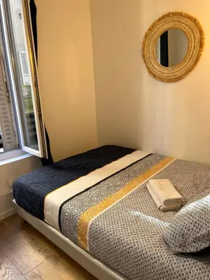 Un ou plusieurs lits dans un hébergement de l'établissement Appartement 2 pièces tout neuf Buttes Chaumont