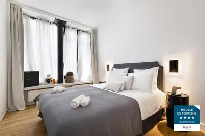 Un ou plusieurs lits dans un hébergement de l'établissement Luxueux LOFT 3BR au coeur du Marais