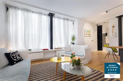Coin salon dans l'établissement Luxueux LOFT 3BR au coeur du Marais