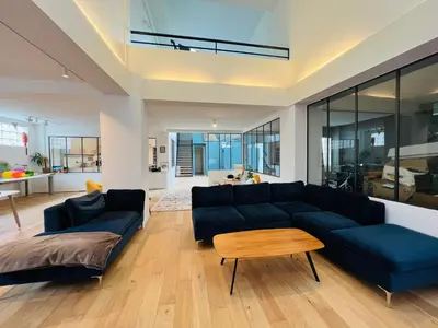 Coin salon dans l'établissement LOFT Triplex 300m² à 10 min PARIS/EXPO
