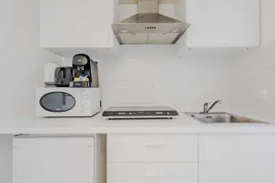 Cuisine ou kitchenette dans l'établissement Joli studio pour 2 personnes - Levallois-Perret