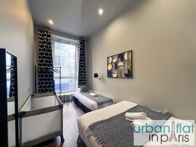Un ou plusieurs lits dans un hébergement de l'établissement Urban Flat 94 - Beautiful Flat Coco Chanel in Paris