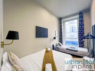 Un ou plusieurs lits dans un hébergement de l'établissement Urban Flat 94 - Beautiful Flat Coco Chanel in Paris