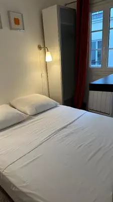 Un ou plusieurs lits dans un hébergement de l'établissement Haut-Marais Joli appartement.