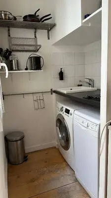 Cuisine ou kitchenette dans l'établissement Haut-Marais Joli appartement.