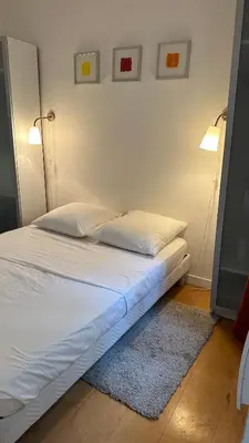 Un ou plusieurs lits dans un hébergement de l'établissement Haut-Marais Joli appartement.