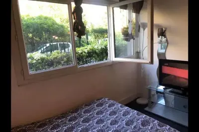 Un ou plusieurs lits dans un hébergement de l'établissement Charming studio,Paris 14 eme