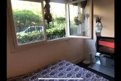Un ou plusieurs lits dans un hébergement de l'établissement Charming studio,Paris 14 eme