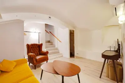 Coin salon dans l'établissement Duplex Charme Bastille - 8P - Confort Premium