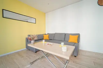 Coin salon dans l'établissement Soleil Vert - Ravissant cocon moderne - proche Stade de France