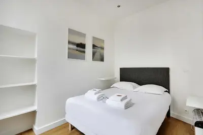 Un ou plusieurs lits dans un hébergement de l'établissement Appart confortable -1BR 4P- Quartier Beaubourg