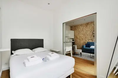 Un ou plusieurs lits dans un hébergement de l'établissement Appart confortable -1BR 4P- Quartier Beaubourg