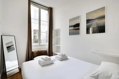 Un ou plusieurs lits dans un hébergement de l'établissement Appart confortable -1BR 4P- Quartier Beaubourg