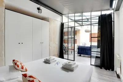 Un ou plusieurs lits dans un hébergement de l'établissement Splendid apartment - 2BR 4P - Sacré-Cœur