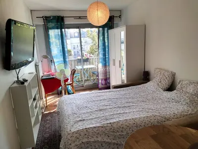 Un ou plusieurs lits dans un hébergement de l'établissement Cozy Studio Bastille with balcony