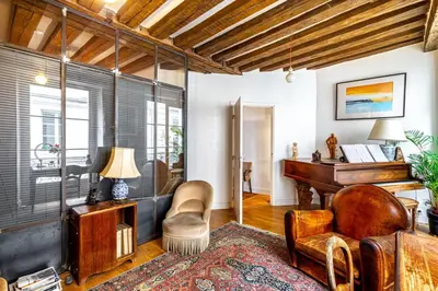 Coin salon dans l'établissement GuestReady - Stone wall stay near Sainte-Chapelle