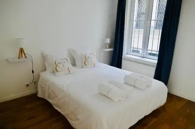 Un ou plusieurs lits dans un hébergement de l'établissement Appartement Cosy Louvre Sentier
