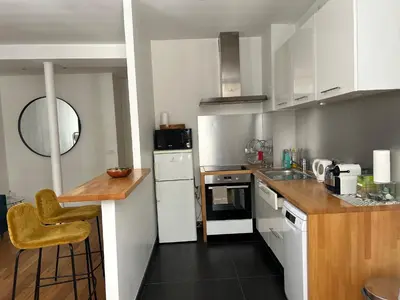 Cuisine ou kitchenette dans l'établissement Appartement Cosy Louvre Sentier