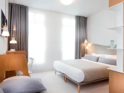 Un ou plusieurs lits dans un hébergement de l'établissement Hotel le Lapin Blanc