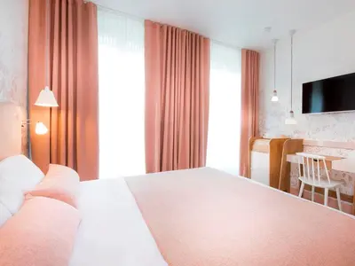 Un ou plusieurs lits dans un hébergement de l'établissement Hotel le Lapin Blanc