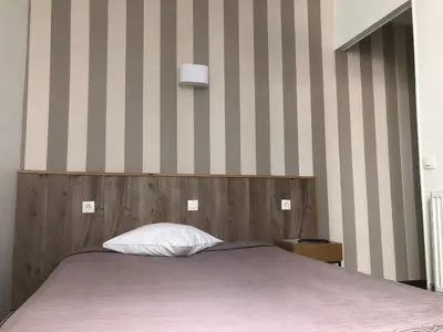Un ou plusieurs lits dans un hébergement de l'établissement Hôtel Résidence Champerret