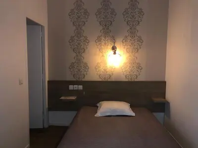 Un ou plusieurs lits dans un hébergement de l'établissement Hôtel Résidence Champerret