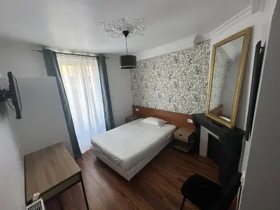 Un ou plusieurs lits dans un hébergement de l'établissement Hôtel Résidence Champerret
