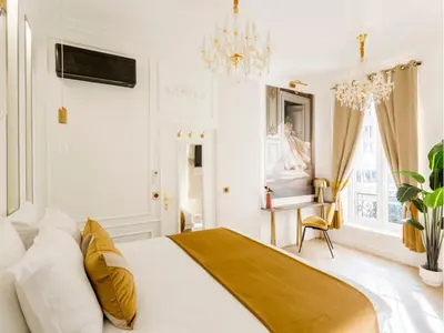 Un ou plusieurs lits dans un hébergement de l'établissement Merveil - Luxury Suite - Marais - Republique