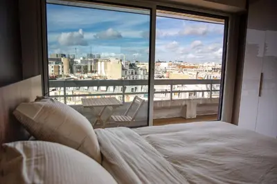 Un ou plusieurs lits dans un hébergement de l'établissement Appartement Vue Tour Eiffel