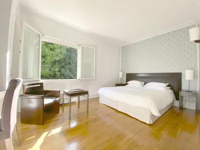 Un ou plusieurs lits dans un hébergement de l'établissement La Villa Paris - B&B