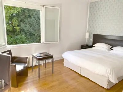 Un ou plusieurs lits dans un hébergement de l'établissement La Villa Paris - B&B