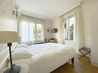 Un ou plusieurs lits dans un hébergement de l'établissement La Villa Paris - B&B