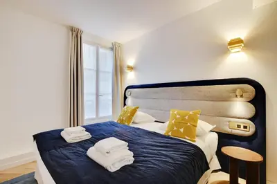 Un ou plusieurs lits dans un hébergement de l'établissement Luxurious Apartment - 3BDR-8P - Bastille